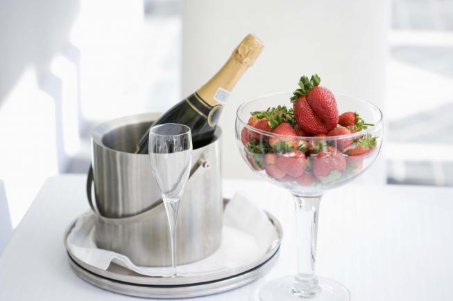A bottle of champagne on ice on arrival and strawberries